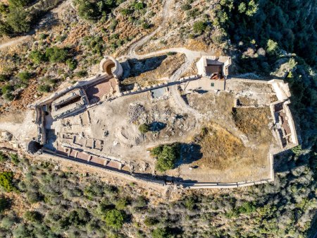 Photo for Aerial view of Bairen medieval castle ruin near Gandia in Spain with partially restored circular towers with cloudy sky - Royalty Free Image