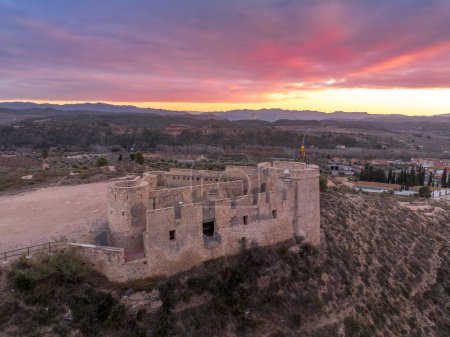 Aerial colorful sky sunset panoramic view of Flix new castle above the Ebro river in Spain with triangular shape circular gun platforms
