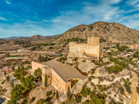 Photo for Aerial view of Petrer, medieval town and hilltop castle with restored tower and battlements near Elda Spain - Royalty Free Image
