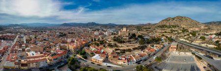 Photo for Aerial view of Petrer, medieval town and hilltop castle with restored tower and battlements near Elda Spain - Royalty Free Image