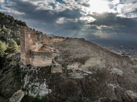 Photo for Aerial view of Pliego town and medieval castle in Southern Spain, ruined walls made of rammed earth with Arab origin - Royalty Free Image