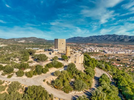 Aerial view of Ulldecona castle, Serra Grossa mountain top, former frontier fortified complex old church, emblematic circular tower and square keep