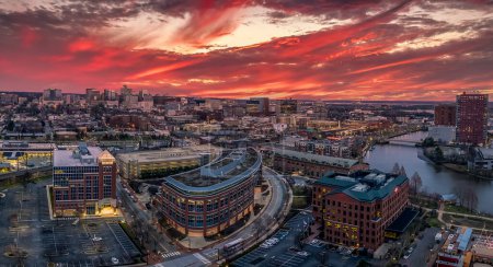 Photo for Aerial panorama view of downtown Wilmington Delaware headquarter of most US banks and companies with dramatic colorful cloudy sunset sky - Royalty Free Image