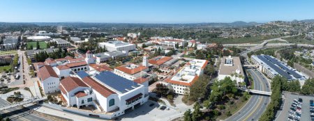 Aerial panorama view of San Diego State University, accredited public higher education institution with centennial plaza, aztec student union, health and human sciences college, love library, rooftop with solar panels