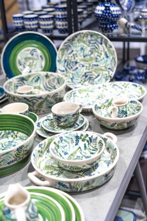 Photo for Traditional porcelain from Boleslawiec in the shop. Handmade pottery in green colours - Royalty Free Image
