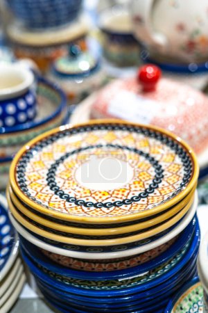Photo for Traditional porcelain plates from Boleslawiec in the shop. Handmade pottery - Royalty Free Image