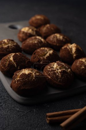 Cinnamon crinkle cookies on a black background, recipe concept. Selective focus, close-up