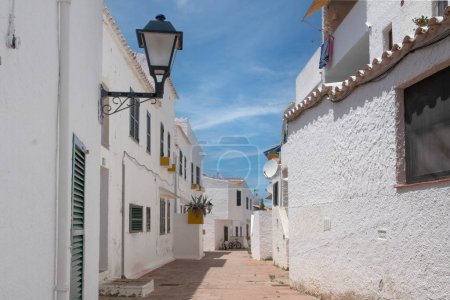 Photo for Streets and white walls of touristic fishing village of Binibeca Nou in Menorca, Spain. - Royalty Free Image