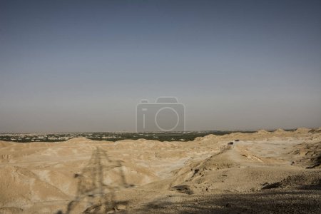 Photo for Al-Qarah mountain is a mesa that stands about 75 metres Al-Qarah village Al Hofuf, Saudi arabia.It has many caves with very cool air inside. Unlike many caves, these were formed by subaerial weathering rather than dissolution, and as a result have a - Royalty Free Image