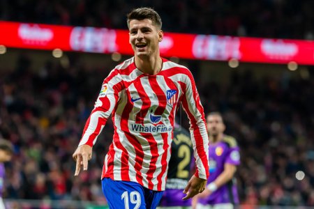 Photo for Madrid, Spain- January 21, 2023: Soccer match between Atletico de Madrid and Real Valladolid at Civitas Metropolitano. Alvaro Morata celebrates with his teammates after scoring a goal. - Royalty Free Image