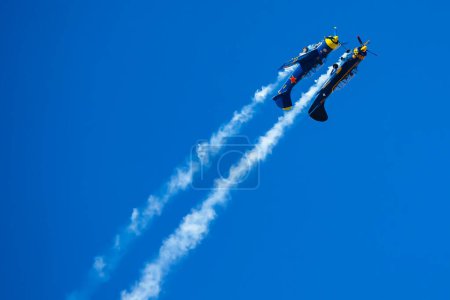 Photo for Madrid, Spain- February 5, 2023: Air show of vintage airplanes over the sky of Madrid. Yakovlev Yack 52 model stunt plane. old planes - Royalty Free Image