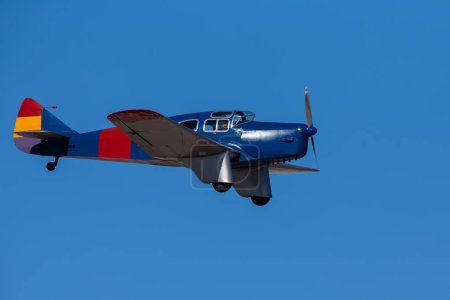 Photo for Madrid, Spain- February 5, 2023: Air show of vintage airplanes over the sky of Madrid. Model Miles Falcon Six M 3.C. old planes - Royalty Free Image