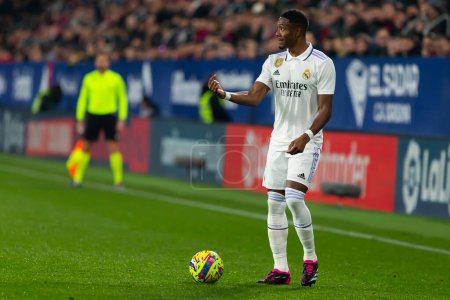 Foto de Madrid, Spain- February 18, 2023: League match between Real Madrid and Osasuna in Pamplona. David Alaba on his knees in the field lamenting. Football game. Real Madrid player. - Imagen libre de derechos