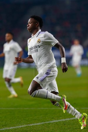 Foto de Madrid, Spain- February 18, 2023: League match between Real Madrid and Osasuna in Pamplona. Vinicius Jr. fighting for the ball. Football games. Real Madrid player. - Imagen libre de derechos