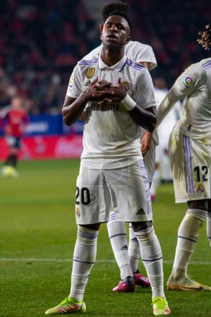 Photo for Madrid, Spain- February 18, 2023: League match between Real Madrid and Osasuna in Pamplona. Vinicius Jr. celebrating a goal. Football games. Real Madrid player. - Royalty Free Image