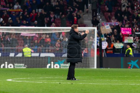 Photo for Madrid, Spain- March 4, 2023: Diego Pablo Simeone receives the support of his family on the field before the game. Simeone says goodbye to Atletico. Football coach. Match records. - Royalty Free Image
