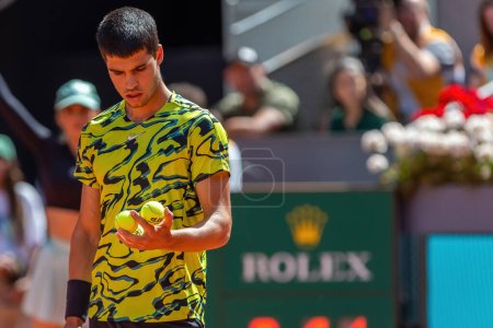 Photo for Madrid, Spain- May 5, 2023: Tennis match at the Mutua Madrid Open between Carlos Alcaraz and Borna Coric with the victory of the Spanish. ATP match. Number 2 in the ATP ranking. - Royalty Free Image