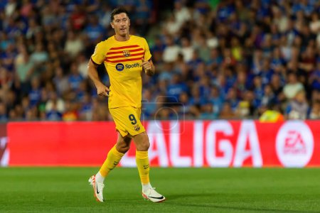 Photo for Madrid, Spain- August 13, 2023: Soccer match between Getafe FC and Barcelona FC of the Spanish EA Sports league. Robert Lewandowki with the ball. Football players. - Royalty Free Image