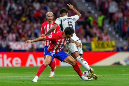 Photo for Madrid, Spain- September 24, 2023: League match between Atletico de Madrid and Real Madrid. Jude Bellingham with the ball. Football players. Victory for Atletico de Madrid. - Royalty Free Image