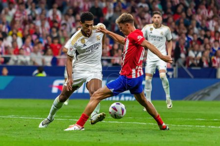 Photo for Madrid, Spain- September 24, 2023: League match between Atletico de Madrid and Real Madrid. Jude Bellingham with the ball. Football players. Victory for Atletico de Madrid. - Royalty Free Image