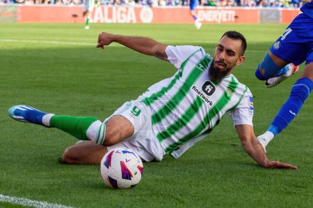 Photo for Madrid, Spain- October 21, 2023: League match between Getafe F.C and Betis played in Madrid. Football players. Borja Iglesias with the ball. - Royalty Free Image
