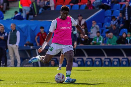 Photo for Madrid, Spain- October 21, 2023: League match between Getafe F.C and Betis played in Madrid. Football players. Assane Diao with the ball. - Royalty Free Image