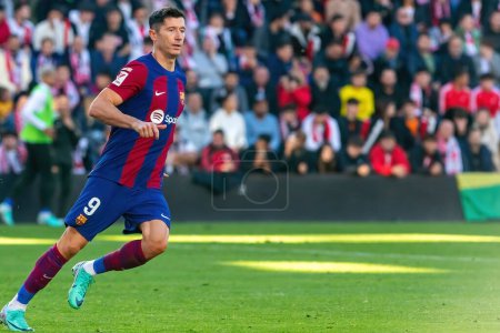 Photo for Madrid, Spain- November 25, 2023: League match between Rayo Vallecano and F.C Barcelona in Madrid. Lewandoski with the ball. Football players. - Royalty Free Image