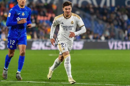 Photo for Madrid, Spain- February 1, 2024: League match between Getafe f.c and Real Madrid played in the capital. Brahim with the ball. Football players. - Royalty Free Image