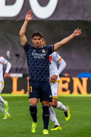 Photo for Madrid, Spain- February 18, 2024: League match between Rayo Vallecano and Real Madrid played in the capital. Brahim during the match. Madrid derby. Professional soccer players. - Royalty Free Image