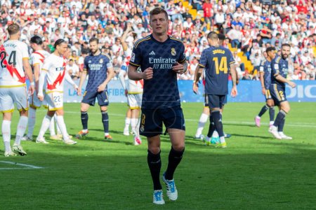 Photo for Madrid, Spain- February 18, 2024: League match between Rayo Vallecano and Real Madrid played in the capital. Toni Kroos during the match. Madrid derby. Professional soccer players. - Royalty Free Image