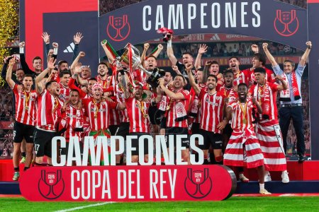 Photo for Seville, Spain- April 6, 2024: Final of the Copa del Rey soccer match between Athletic Club de Bilbao and Real Mallorca. The Athletic players celebrate the victory. - Royalty Free Image