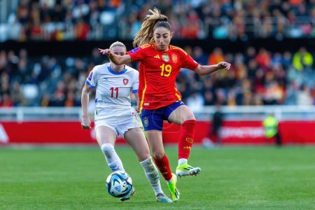 Photo for Burgos, Spain- April 9, 2024: Match of the Spanish women's soccer team against the Czech Republic held in Burgos. Olga Carmona with the ball. Women soccer players. Women's Football. - Royalty Free Image