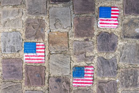 Photo for Cable stones painted with the American flag in Carentan France. - Royalty Free Image