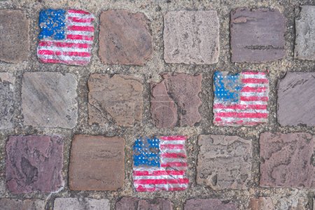 Photo for Cable stones painted with the American flag in Carentan France. - Royalty Free Image
