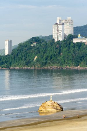 Photo for Pedra Da Feiticeira statue on the beach of Sao Vicente, Brazil. April 2 2024. - Royalty Free Image