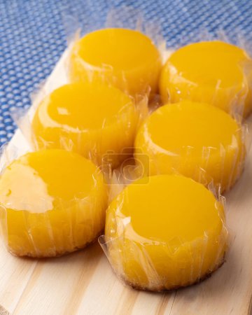 Photo for Closeup of quindins, traditional egg and coconut brazilian dessert. - Royalty Free Image