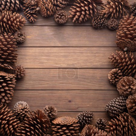 Photo for Group of pinecones over wooden table with copy space. - Royalty Free Image