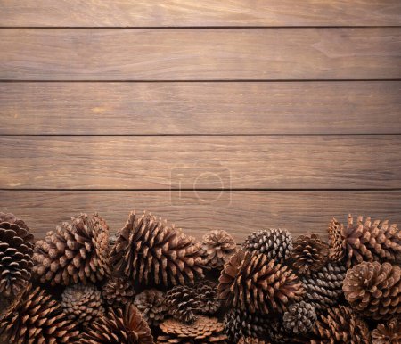 Photo for Group of pinecones over wooden table with copy space. - Royalty Free Image