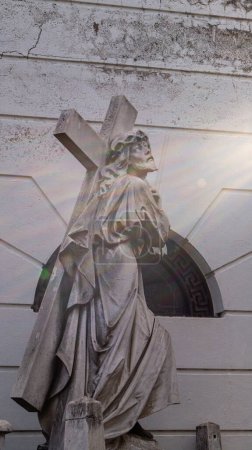 Photo for Close view of a Jesus Christ carrying the cross stone sculpture, located at Recoleta cemetery - Royalty Free Image