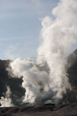 Foto de Clouds of gas rising from a volcano, Mt Io, Hokkaido - Imagen libre de derechos