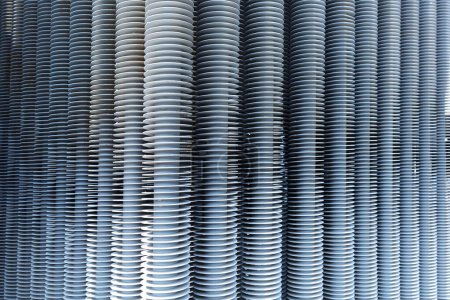 Photo for Transformer cooling fins. Old row of radiator fins on tubes of large outdoor power transformer for cooling system with copy space. selective focus - Royalty Free Image