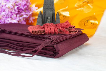 Kasaya are the robes of fully ordained Buddhist monks. In Sanskrit and Pali cvara. constructed of discarded fabric. antarvasa, uttarasanga and samghati together they forms "triple robe," or ticivara. Sanghadana.