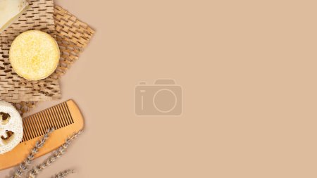 Photo for Eco solid shampoo bar and wooden comb laying on a Honeycomb Paper, coffee colored background. Eco friendly hair care. Plastic free, zero waste living, low water ingredients. Copy space. - Royalty Free Image