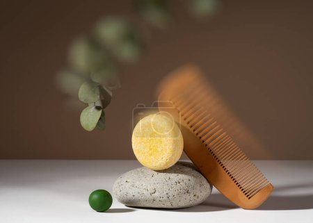 Photo for Modern still life composition of a solid shampoo bar with kaleidoscopic glitch effect. Shampoo bar and a wooden comb balancing on a brown background. Plastic free, zero waste, low water ingredients. - Royalty Free Image
