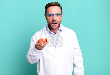 Photo for Middle age man looking very shocked or surprised. scientist concept - Royalty Free Image