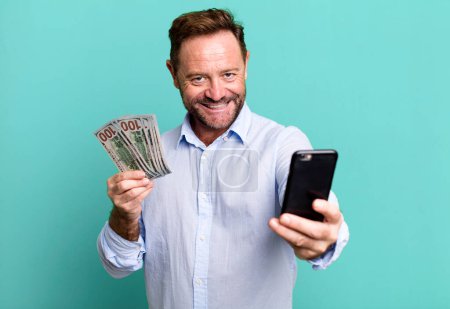 Photo for Middle age man with dollar banknotes. online shopping concept sport coach concept with a soccer ball - Royalty Free Image