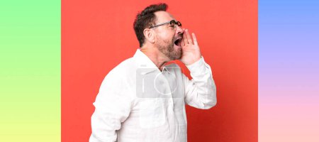 Photo for Profile view, looking happy and excited, shouting and calling to copy space on the side - Royalty Free Image