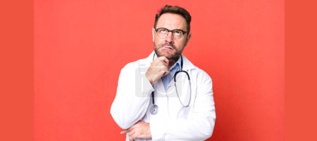 Photo for Middle age man thinking, feeling doubtful and confused. physician concept - Royalty Free Image