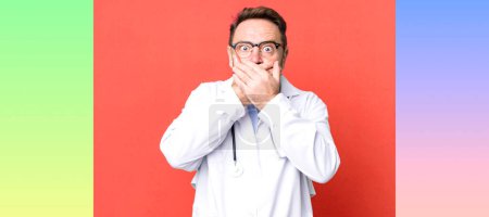 Photo for Middle age man covering mouth with hands with a shocked. physician concept - Royalty Free Image