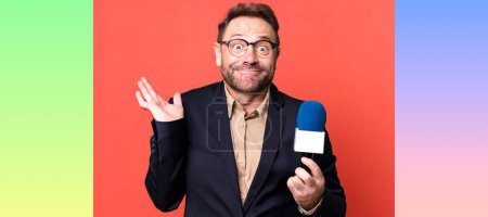 Photo for Middle age man feeling puzzled and confused and doubting. journalist and a microphone concept - Royalty Free Image